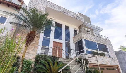 Casa em condomínio fechado com 4 quartos à venda na Rua Tocantins, 540, Agronomia, Porto Alegre por R$ 1.700.000