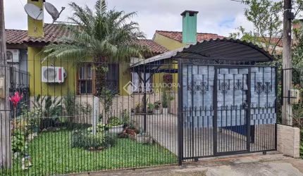 Casa em condomínio fechado com 2 quartos à venda na Rua Capitão Pedroso, 769, Restinga, Porto Alegre, 109 m2 por R$ 210.000