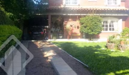 Casa em condomínio fechado com 3 quartos à venda na Rua dos Guenoas, 796, Guarujá, Porto Alegre, 300 m2 por R$ 1.080.000