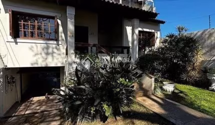 Casa com 4 quartos à venda na Rua Butuí, 173, Cristal, Porto Alegre, 376 m2 por R$ 950.000