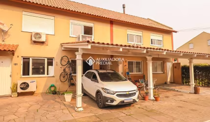 Casa em condomínio fechado com 2 quartos à venda na Rua Treze de Maio, 630, Rio Branco, Canoas, 103 m2 por R$ 280.000