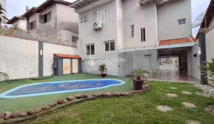 Casa com 3 quartos à venda na Rua dos Bem-te-vis, 56, Jardim Algarve, Alvorada, 173 m2 por R$ 730.000