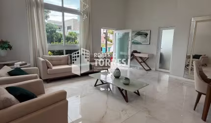 Casa Térrea a venda de 6 suítes, piscina e área gourmet com churrasqueira e 4 garagens em Alphaville Litoral Norte 2