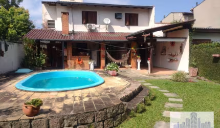 Casa com 3 dormitórios à venda, 235 m² por R$ 744.000,00 - Guarujá - Porto Alegre/RS