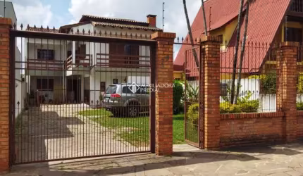 Casa com 7 quartos à venda na Rua General Telino Chagastelles, 75, Parque Santa Fé, Porto Alegre, 270 m2 por R$ 549.000