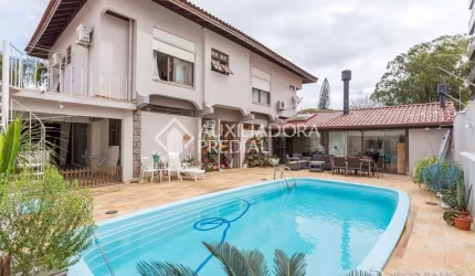 Casa em condomínio fechado com 3 quartos à venda na Avenida Montreal, 356, Jardim Lindóia, Porto Alegre, 380 m2 por R$ 1.600.000