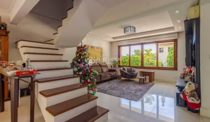 Casa em condomínio fechado com 3 quartos à venda na Estrada João de Oliveira Remião, 1761, Agronomia, Porto Alegre, 241 m2 por R$ 849.000