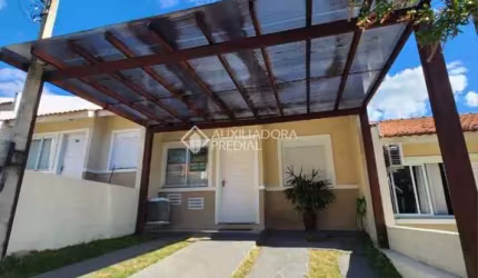 Casa em condomínio fechado com 2 quartos à venda na Rua Oscar Schick, 2350, Formoza, Alvorada, 66 m2 por R$ 288.000