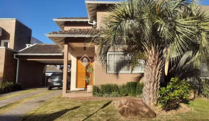 Casa em condomínio fechado com 3 quartos à venda na Avenida Senador Salgado Filho, 8500, Querência, Viamão, 196 m2 por R$ 1.200.000