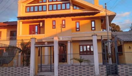 Casa com 4 quartos à venda na Avenida Vasco Alves Pereira, 6, Morada da Colina, Guaíba, 106 m2 por R$ 980.000