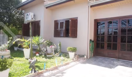 Casa em condomínio fechado com 3 quartos à venda na Rua Visconde de Taunay, 73, Harmonia, Canoas, 105 m2 por R$ 490.000