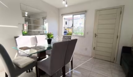 Casa em condomínio fechado com 3 quartos à venda na Rua dos Guaramirins, 303, Igara, Canoas, 107 m2 por R$ 450.000