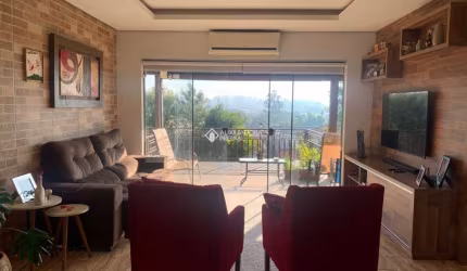 Casa em condomínio fechado com 3 quartos à venda na Estrada dos Guterres, 2565, Fiuza, Viamão, 153 m2 por R$ 901.000