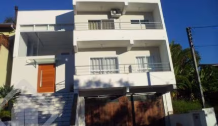 Casa em condomínio fechado com 3 quartos à venda na Avenida Senador Salgado Filho, 6614, Jardim Krahe, Viamão, 400 m2 por R$ 950.000