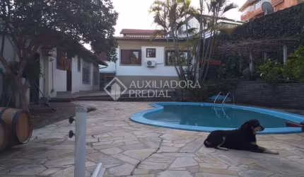 Casa em condomínio fechado com 4 quartos à venda na Rua Primeiro de Maio, 42, Partenon, Porto Alegre, 336 m2 por R$ 1.350.000