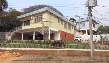 Casa em condomínio fechado com 3 quartos à venda na Rua Engenheiro Leovegildo Paiva, 73, Santa Tereza, Porto Alegre, 306 m2 por R$ 699.000
