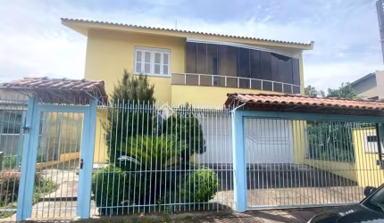 Casa em condomínio fechado com 4 quartos à venda na Rua Cinamomo, 109, São Lucas, Viamão, 269 m2 por R$ 850.000