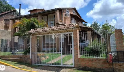 Casa em condomínio fechado com 4 quartos à venda na Rua Mogno, 24, Cantegril, Viamão, 190 m2 por R$ 550.000