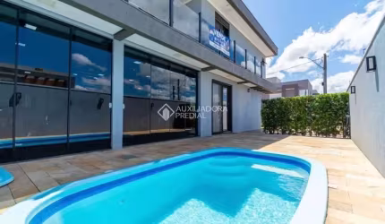 Casa em condomínio fechado com 3 quartos à venda na DAS CEREJEIRAS, 43, Parque da Matriz, Gravataí, 257 m2 por R$ 1.089.000