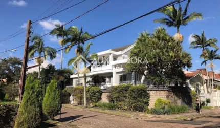 Casa em condomínio fechado com 5 quartos à venda na Rua Desembargador Hugo Candal, 230, Três Figueiras, Porto Alegre, 470 m2 por R$ 2.490.000