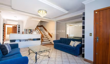Casa em condomínio fechado com 4 quartos à venda na Rua Santini Longoni, 293, Marechal Rondon, Canoas, 300 m2 por R$ 990.000