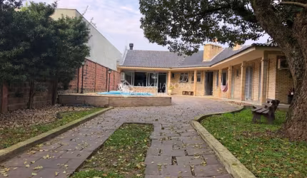Casa em condomínio fechado com 5 quartos à venda na Rua Bagé, 623, Niterói, Canoas, 235 m2 por R$ 1.250.000