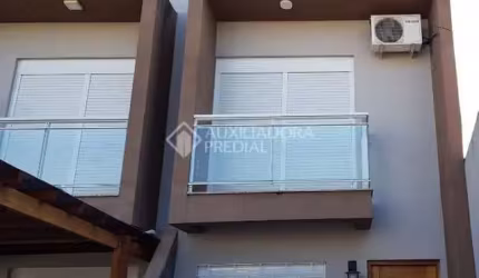 Casa em condomínio fechado com 2 quartos à venda na Rua Jardim América, 222, Harmonia, Canoas, 76 m2 por R$ 415.000