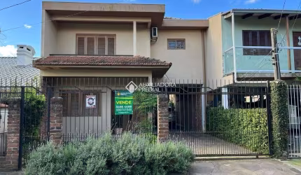 Casa em condomínio fechado com 3 quartos à venda na Rua Felipe de Oliveira, 85, Harmonia, Canoas, 176 m2 por R$ 426.000