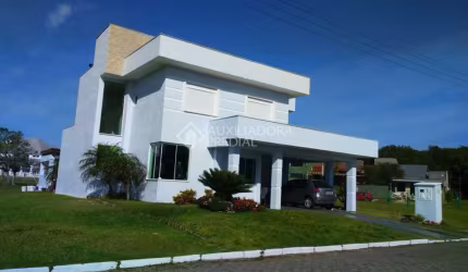 Casa em condomínio fechado com 4 quartos à venda na Rua Grama Azul, 7400, Centro, Tramandaí, 280 m2 por R$ 1.054.000