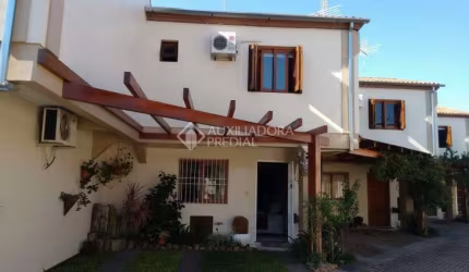 Casa em condomínio fechado com 3 quartos à venda na Rua Tomé de Souza, 137, Nossa Senhora das Graças, Canoas, 95 m2 por R$ 650.000