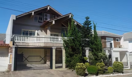 Casa em condomínio fechado com 4 quartos à venda na Avenida Inconfidência, 1399, Marechal Rondon, Canoas, 427 m2 por R$ 1.900.000