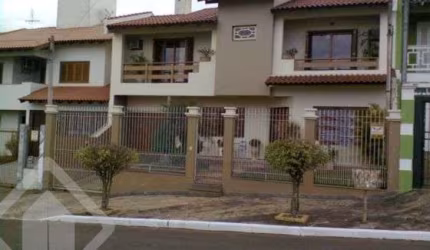 Casa em condomínio fechado com 3 quartos à venda na Rua Turquia, 42, Marechal Rondon, Canoas, 275 m2 por R$ 1.600.000