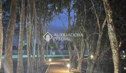 Terreno em condomínio fechado à venda na Avenida Beira Mar, 48300, Arroio Teixeira, Capão da Canoa, 350 m2 por R$ 266.000