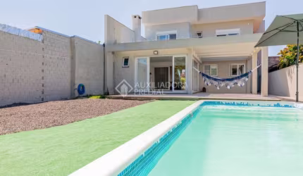 Casa em condomínio fechado com 3 quartos à venda na Rua Tamoio, 2344, Niterói, Canoas, 315 m2 por R$ 1.390.000