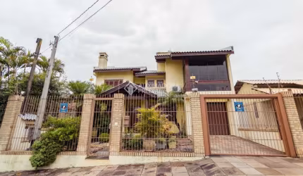 Casa em condomínio fechado com 4 quartos à venda na Travessa Porto Príncipe, 59, Jardim Lindóia, Porto Alegre, 304 m2 por R$ 1.650.000