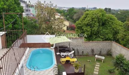 Casa em condomínio fechado com 3 quartos à venda na Avenida Doutor Rubem Knijnik, 533, Costa e Silva, Porto Alegre, 120 m2 por R$ 450.000