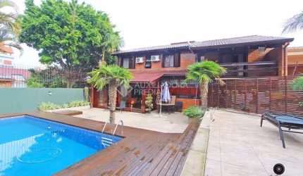 Casa em condomínio fechado com 3 quartos à venda na Rua Walir Zottis, 352, Jardim Itu Sabará, Porto Alegre, 330 m2 por R$ 1.850.000