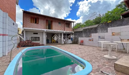 Casa com 3 quartos à venda na Rua Álvaro Nicofé, 150, Vila Jardim, Porto Alegre, 528 m2 por R$ 550.000