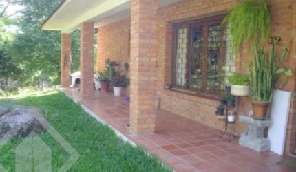 Casa em condomínio fechado com 3 quartos à venda na Estrada Kanazawa, 84, Vila Nova, Porto Alegre, 300 m2 por R$ 700.000