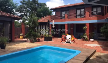 Casa em condomínio fechado com 4 quartos à venda na Rua Walter Kaufmann, 6, Jardim Itu Sabará, Porto Alegre, 357 m2 por R$ 1.600.000