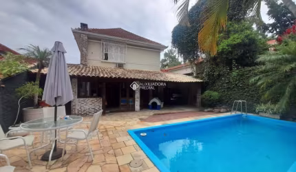 Casa em condomínio fechado com 4 quartos à venda na Rua Camerino, 152, Petrópolis, Porto Alegre, 390 m2 por R$ 1.650.000