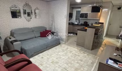 Casa com 2 quartos à venda na Rua Biguás, 481, Jardim Algarve, Alvorada, 98 m2 por R$ 340.000