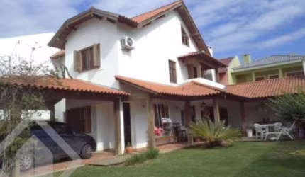 Casa em condomínio fechado com 3 quartos à venda na Rua Corticeira, 143, Hípica, Porto Alegre, 216 m2 por R$ 1.080.000