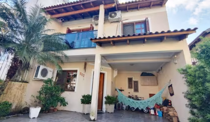 Casa em condomínio fechado com 3 quartos à venda na Rua Pau Brasil, 329, Hípica, Porto Alegre, 140 m2 por R$ 580.000