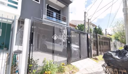 Casa em condomínio fechado com 3 quartos à venda na Rua Pau Brasil, 539, Hípica, Porto Alegre, 149 m2 por R$ 640.000