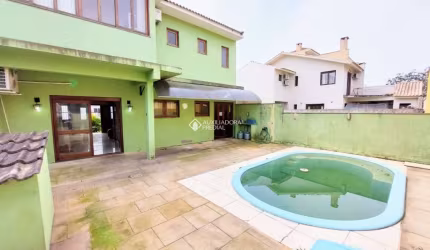Casa em condomínio fechado com 3 quartos à venda na Rua Louro, 34, Hípica, Porto Alegre, 167 m2 por R$ 650.000