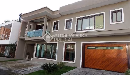 Casa em condomínio fechado com 3 quartos à venda na Rua Carlos Maximiliano Fayet, 80, Hípica, Porto Alegre, 305 m2 por R$ 1.100.000