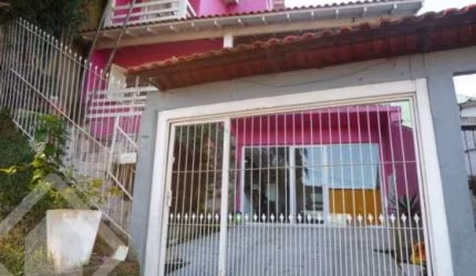 Casa em condomínio fechado com 3 quartos à venda na Rua Erechim, 70, Nonoai, Porto Alegre, 300 m2 por R$ 600.000