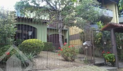 Casa em condomínio fechado com 4 quartos à venda na Rua Comandai, 560, Cristal, Porto Alegre, 300 m2 por R$ 850.000