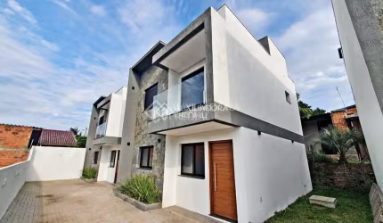 Casa em condomínio fechado com 2 quartos à venda na Rua Venâncio Aires, 672, Canudos, Novo Hamburgo, 92 m2 por R$ 480.000